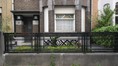 Rue Edmond Rostand 34, clôture en fer et rez-de-chaussée, 2015
