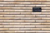 Avenue Père Damien 24, détail du parement de briques, à gauche de la porte, avec la signature de l’architecte, 2003