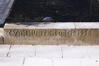 Pater Damiaanlaan 28, signatuur op nog resterende sokkel van tuinomheining, 2003