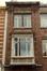 Rue des Moissons 10, oriel en bois et fenêtres géminées à l'étage supérieur (photo 1993-1995)