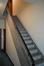 Avenue Houba de Strooper 728. Cage d'escalier avec accès à l'ascenseur derrière © Homegrade, 2025