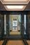 Adolphe Buyllaan 173. Vestibule met lift aan het uiteinde van het perspectief © Homegrade, 2025