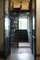 Sint-Bernardusstraat 76. Lift op de bovenste verdieping met open deuren en vouwhekken &copy; Homegrade, 2026