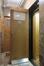 Avenue Winston Churchill 116. Ascenseur au rez-de-chaussée avec porte palière et grille rétractile ouvertes © Homegrade, 2024