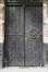 Deur met rijk uitgewerkte hengsels, 'Institut supérieur de peinture Van Der Kelen–Logelain', Metaalstraat 30, Sint-Gillis, 1881, kunstsmid Prosper Schrijvers, 2004
